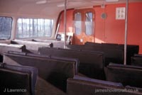 Sidewall craft berthed against jetty